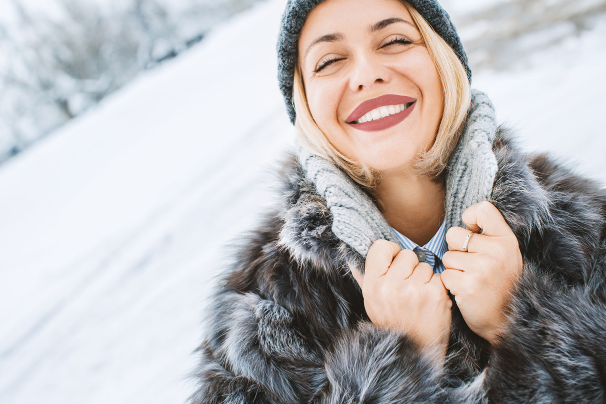 Woman enjoying beautiful skin in the winter